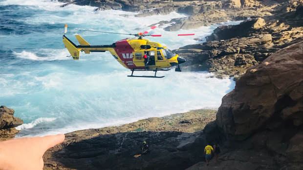 The Westpac Life Saver Rescue Helicopter winched four children to safety at Bermagui after they became stranded on the rocks as the tide came in on Tuesday, January 15, 2019. 