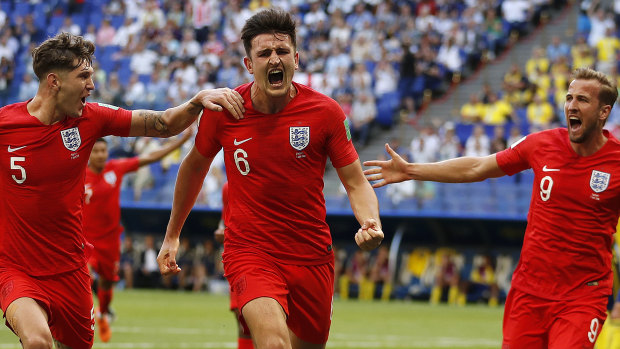Heading for the semis:   Harry Maguire scores England's first goal against Sweden.