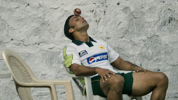 Pakistan cricketer Shoaib Akhtar tries to balance a ball on his forehead during a practice session in India in 2007. 