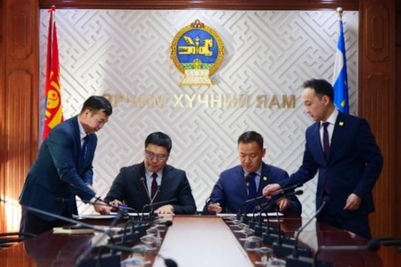 Mongolia’s Ministry of Energy signing a memorandum of understanding to study the use of coal seam gas as an added fuel source, alongside TMK Energy representatives. 