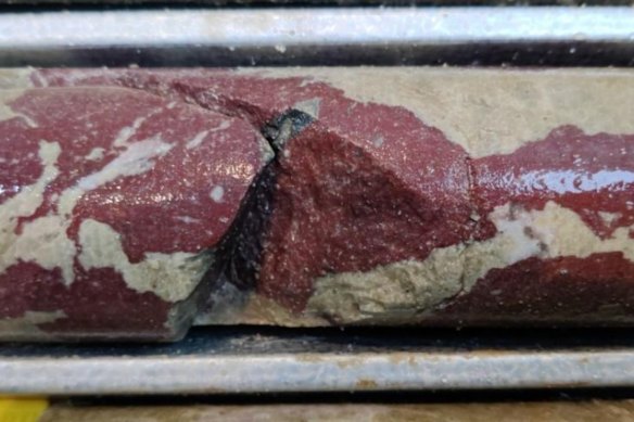 Eclipse Metals’ diamond core from ~104m depth in its Greenland rare earths deposit confirms patchy red bastnäsite in a beige carbonate matrix. Bastnäsite is a rare fluorocarbonate mineral that is a primary source of rare earth elements.