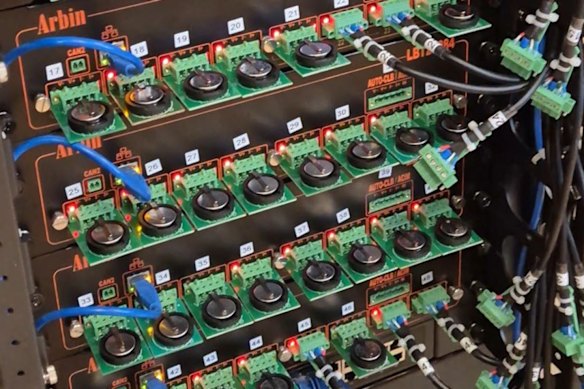 Critical Resources test cells under evaluation on a 48-channel Arbin coin-cell cycler at the South Dakota School of Mines & Technology.