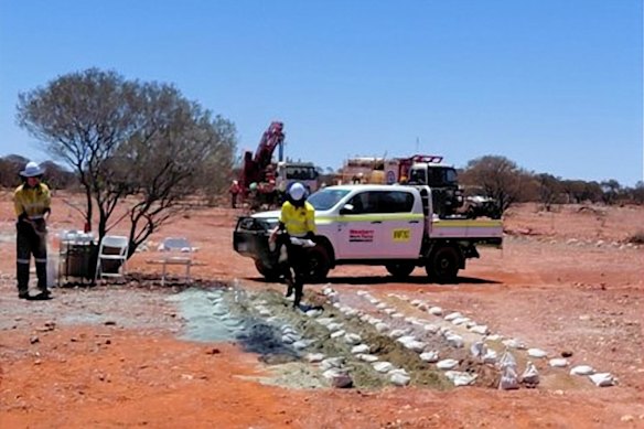 Golden Dragon Mining undertaking drill hole sampling at Coodardy in Western Australia.