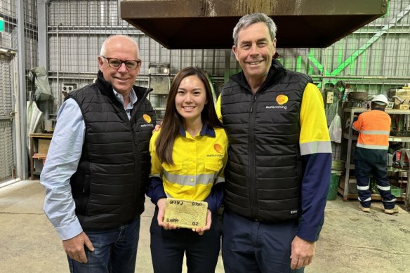 Auric Mining managing director Mark English, company secretary and finance manager Catherine Yeo and technical director John Utley with a gold doré bar at the Greenfields Mill on August 6.