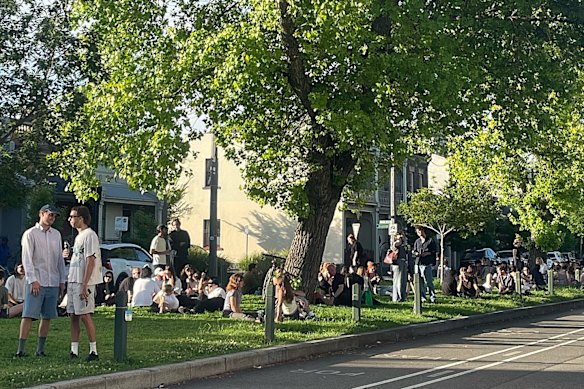 Patrons enjoying the grassy median strip of Canning Street. 