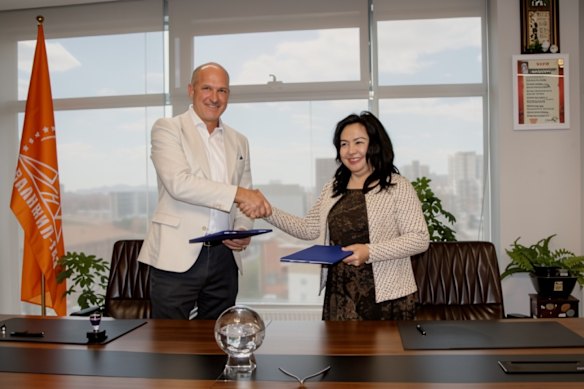 TMK chief executive officer Dougal Ferguson and Dashvaanjil group vice director Sarangerel Byamba signing a milestone agreement in Ulaanbaatar, Mongolia.