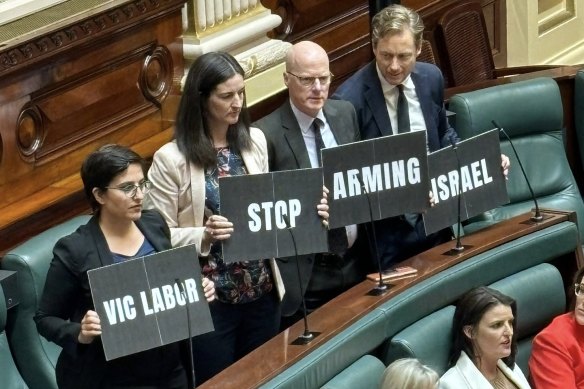 Victorian Greens MPs Gabrielle de Vietri, Ellen Sandell, Tim Read and Sam Hibbins pose with a slogan.