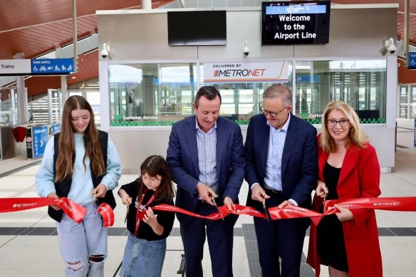 Premier Mark McGowan (centre), PM Anthony Albanese and WA Transport Minister Rita Saffioti cut the ribbon at the opening of Perth’s Metronet Airport Link on Sunday.