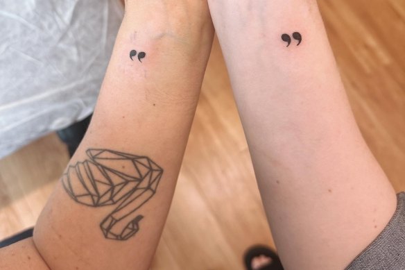 Jacinta Parsons and her friend Ineke show off their matching “quote” tattoos. 