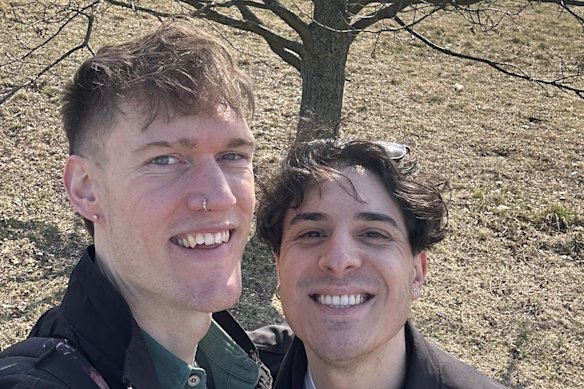 Liam Heitmann-Ryce-LeMercier with his fiance Alex, in front of tree where they were engaged a year earlier. 