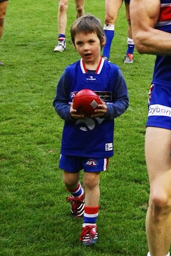 Sam Darcy as a four-year-old, following his dad Luke being chaired from the ground in 2007.