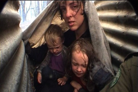 Bron, Lola and Dom Sparkes sheltering between the tanks after the worst of the fire had passed.