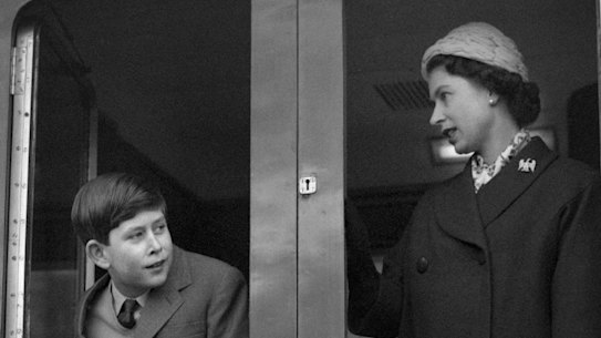 Charles as a boy with his mother the Queen, as the royal train leaves Weymouth in southern England.