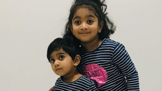 Tharunicaa, left, is pictured with her four-year-old sister Kopika.