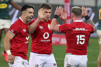 Conor Murray, Owen Farrell and Stuart Hogg celebrate.