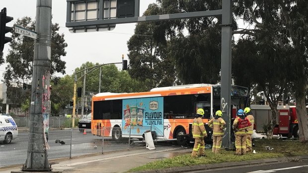 A bus driver was trapped after a collision with a truck in St KIlda.
