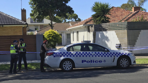 Police at a home in Altona, where a man's body was found.