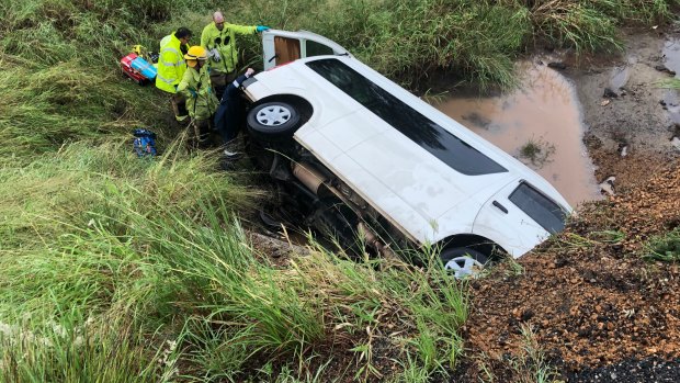 Five people were inside the mini bus when it rolled near Rockhampton on Friday evening. 
