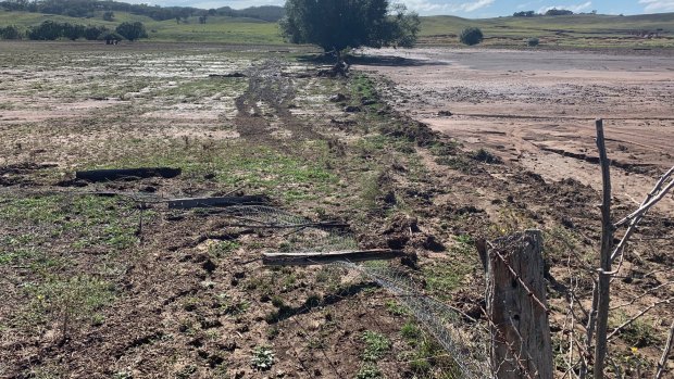 The damage to Mr Orr's fences and paddocks from the rain.