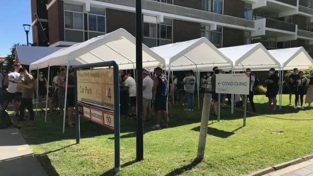 Massive lines form at COVID-19 clinics across Perth as arrivals from NSW rush to get tested. 