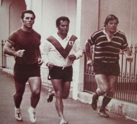 John Sattler in his volleys, along with Souths teammates Eric Simms and Bob McCarthy, jog the back streets of Redfern.