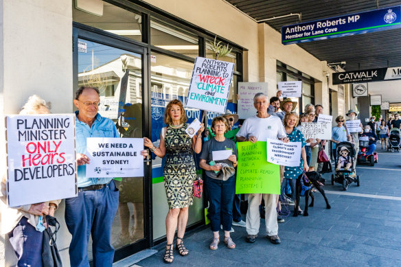 Protesters outside the electorate office of Planning Minister Anthony Roberts in Lane Cove on Monday.