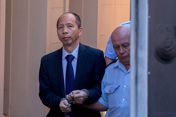 Robert Xie is led away in February 2017 after being given five life sentences.