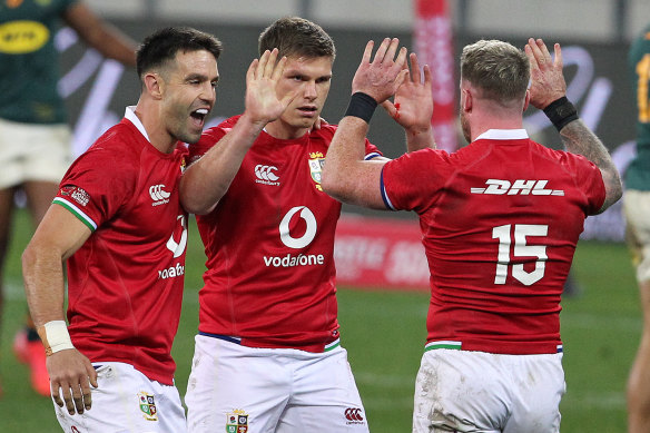 Conor Murray, Owen Farrell and Stuart Hogg celebrate.