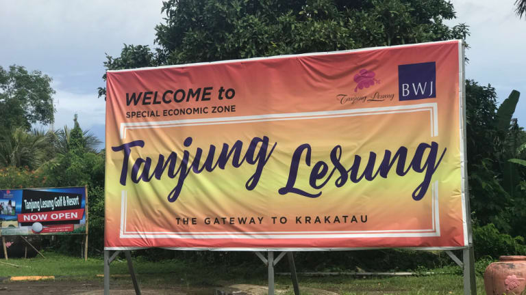 A sign advertising Tanjung Lesung beach resort. 