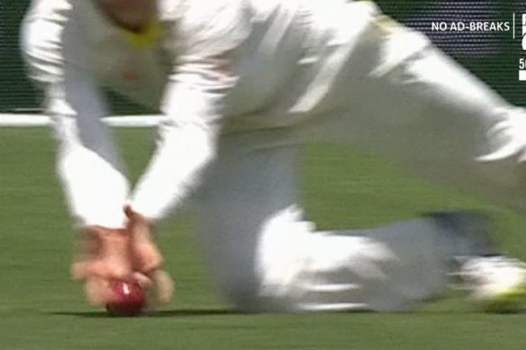 Touch and go: A video still of the dismissal. Did Peter Handscomb get his fingers underneath the ball?