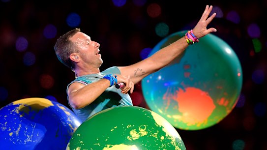 Chris Martin of Coldplay performs on stage at Marvel Stadium.