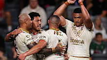  Sione Katoa of Tonga celebrates scoring a try with team mates