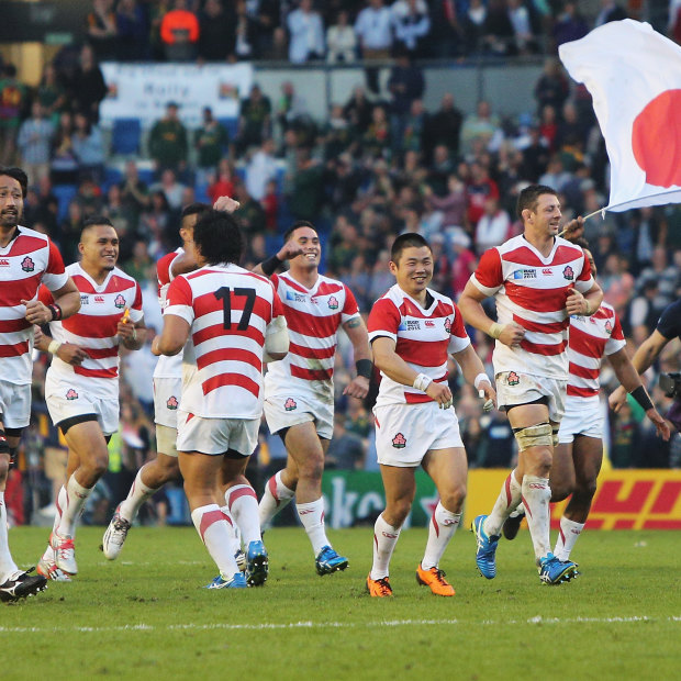 Japan players celebrate their surprise victory over South Africa in the 2015 Rugby World Cup.