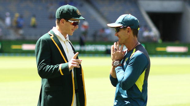 Tim Paine and Justin Langer have a chat. 
