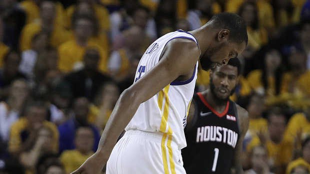 Massive loss: Kevin Durant limps off the court in the game five victory over Houston.