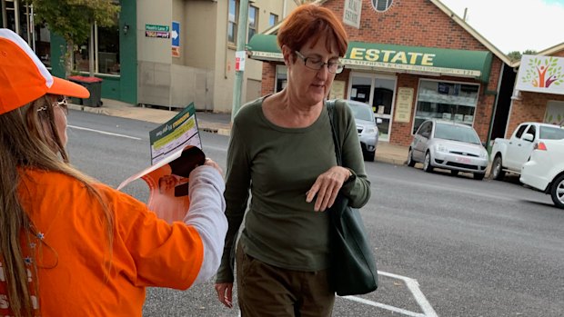 A One Nation volunteer in Bathurst also distributing Nationals how to vote cards.