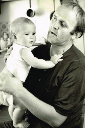 Louise Olsen as a baby with her father John.