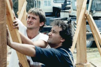 Richard Glover and Philip Clark build the frame of Richard's mud-brick house.