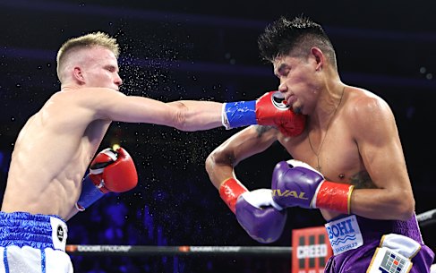 Liam Wilson lands a punch on Emanuel Navarrete.