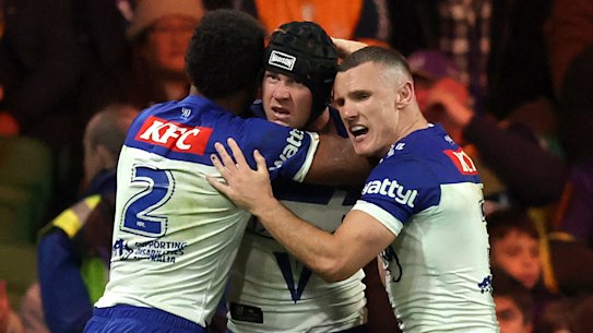 MELBOURNE, AUSTRALIA - SEPTEMBER 12: Matt Burton of the Bulldogs celebrates with team mates after scoring a try during the NRL Qualifying Final match between the Melbourne Storm and Canterbury Bulldogs at AAMI Park on September 12, 2025, in Melbourne, Australia. (Photo by Robert Cianflone/Getty Images)