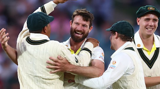 Michael Neser gets the pats on the backs from teammates.