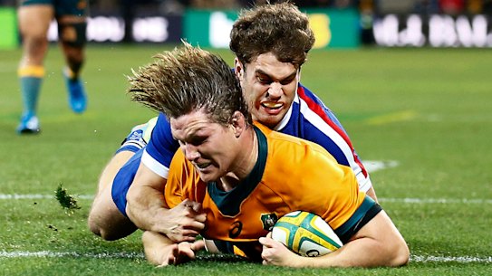 Michael Hooper goes over for a try.