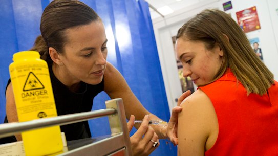 Pharmacists and doctors trade jabs over the best time to get flu shot