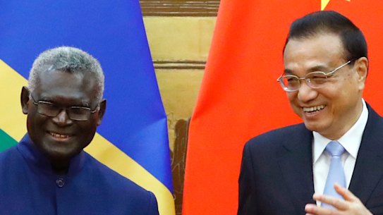 Solomon Islands Prime Minister Manasseh Sogavare with Chinese Premier Li Keqiang in Beijing in October 2019.