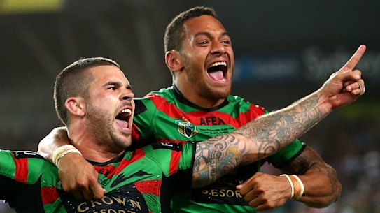 Adam Reynolds and Api Koroisau celebrate South Sydney's 2014 grand final win against the Bulldogs.