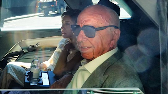 Rupert Murdoch is seen leaving the Herald Sun building in Melbourne on Thursday with his wife Elena Zhukova.