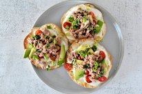 Prep ahead, then assemble these Mediterranean tuna and whipped hummus crisps to order.