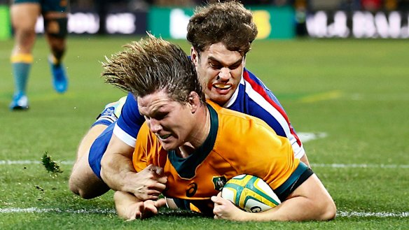 Michael Hooper goes over for a try.