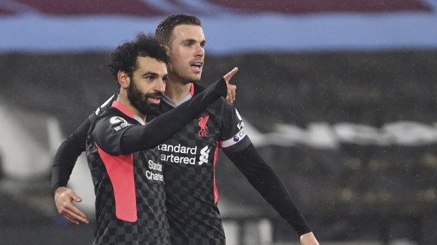 Liverpool’s Mohamed Salah (left) celebrates with Jordan Henderson after scoring his side’s second goal in the win over West Ham on January 31.
