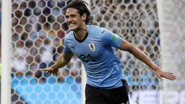 Clinical: Uruguay's Edinson Cavani celebrates scoring the opener against Portgual during the group stage.